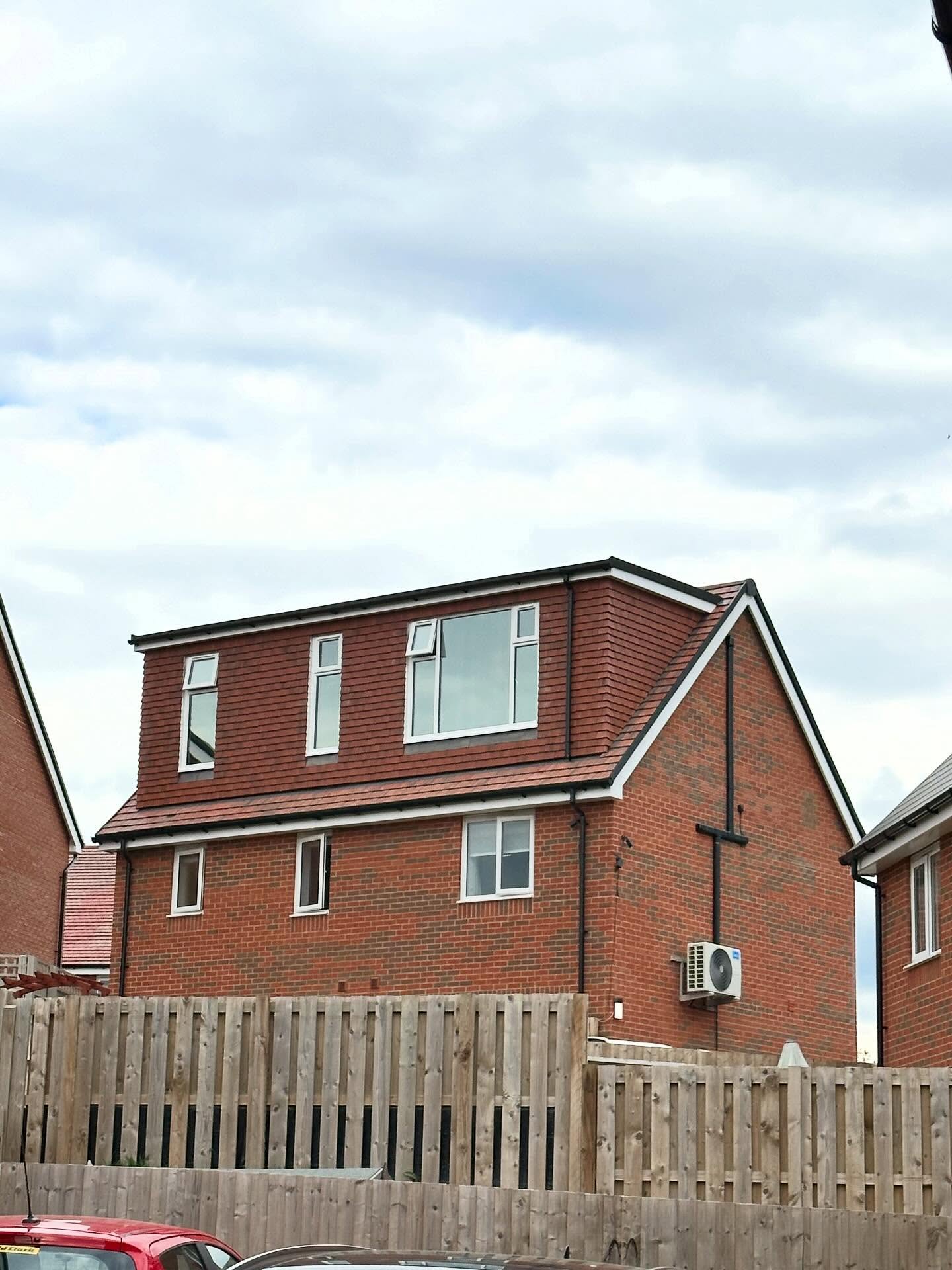 Rear dormer loft conversion with tiled exterior and new windows